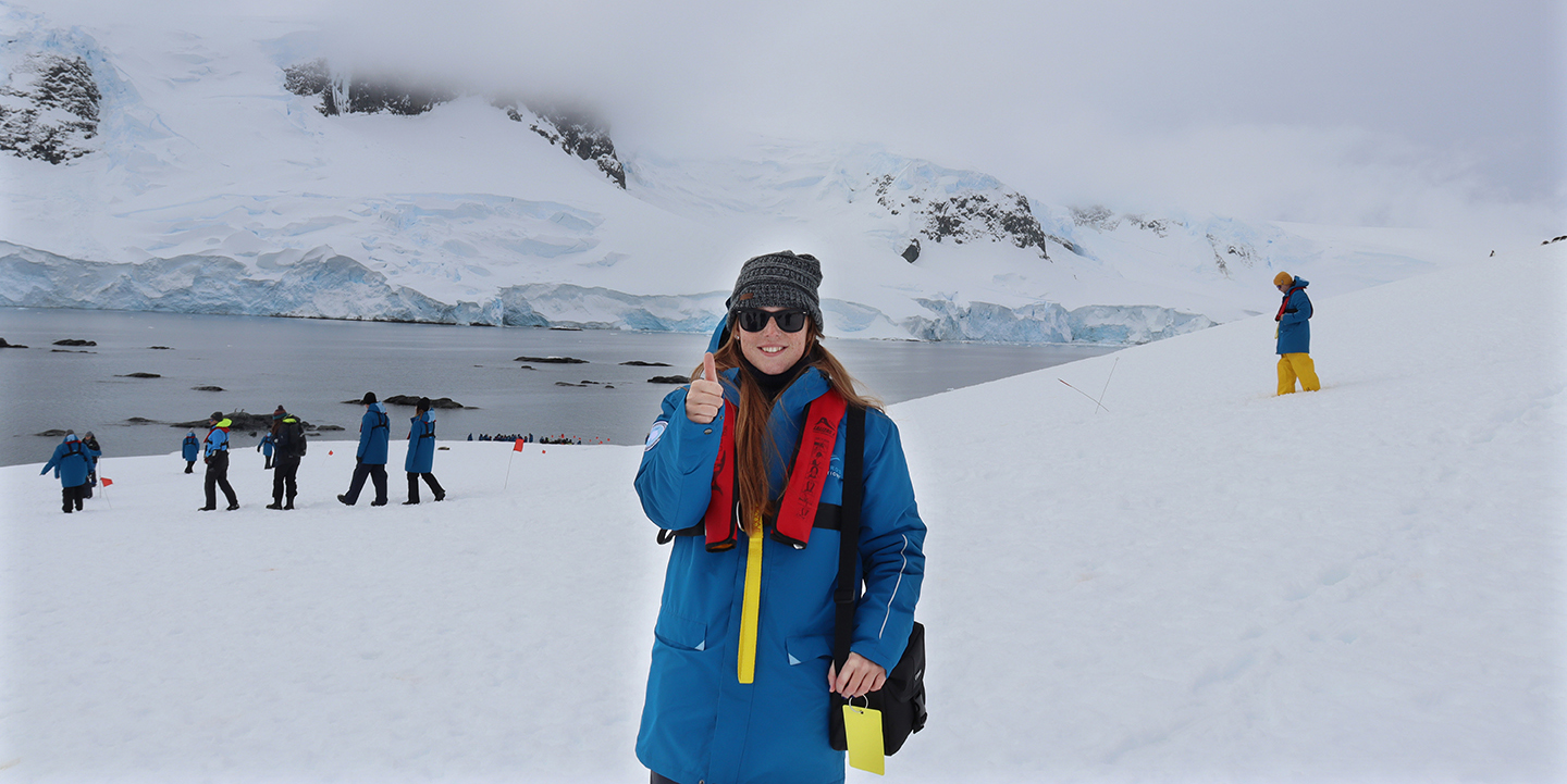 student thumbs up in snowy Antarctica 