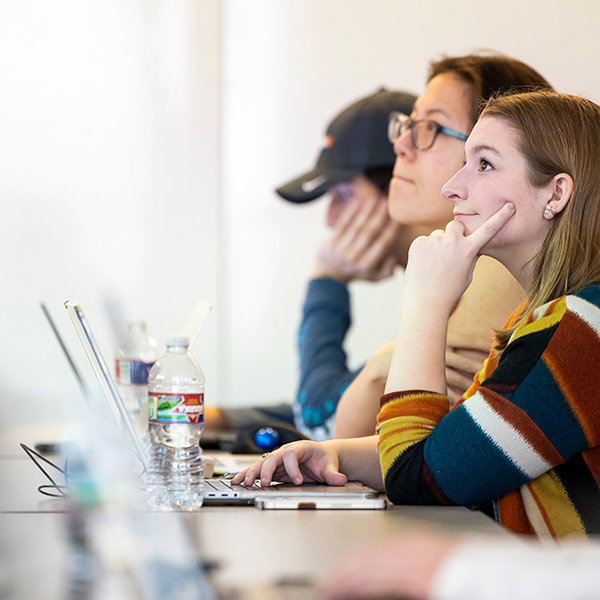 students at a lecture on laptops